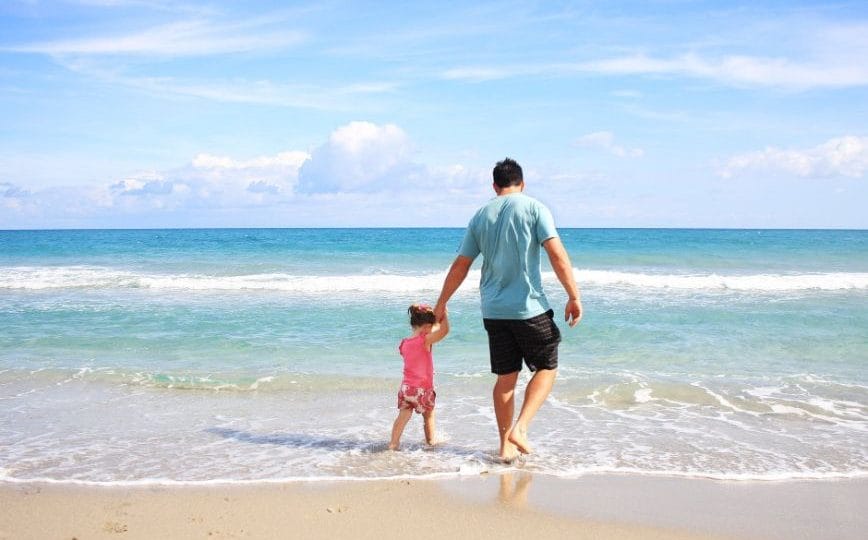 Father And Daughter Playing On A Beach Stay Fit On Vacation