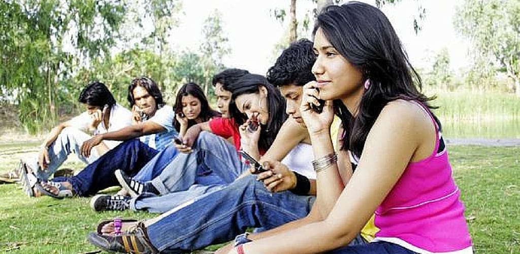 Friends talking on phone in group trending us