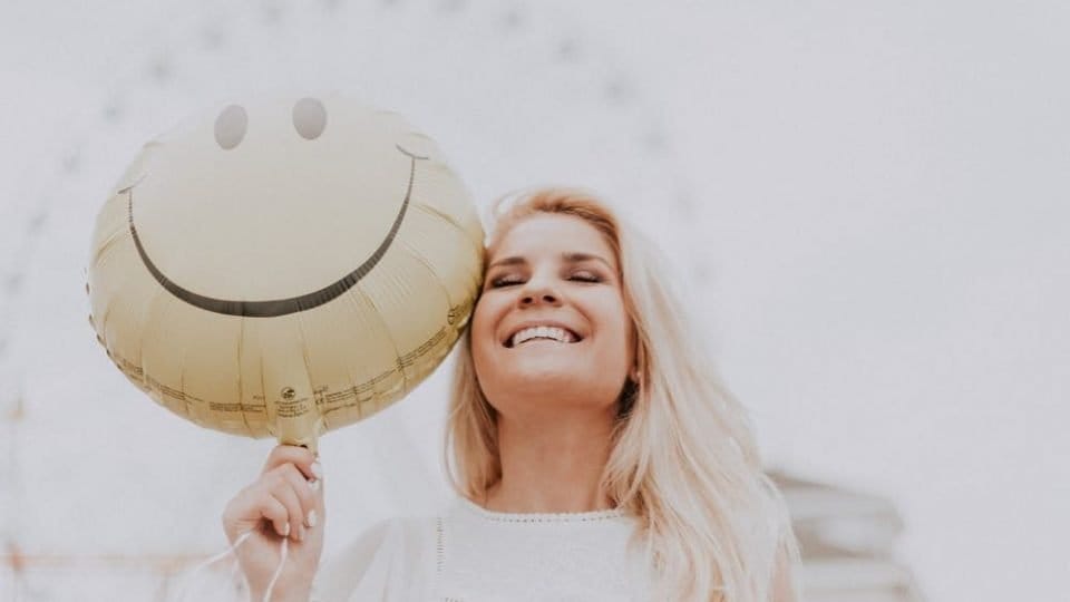 Smiling Woman Overcome Sadness