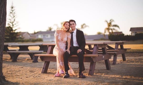 couple sitting in a park - why hard work is important