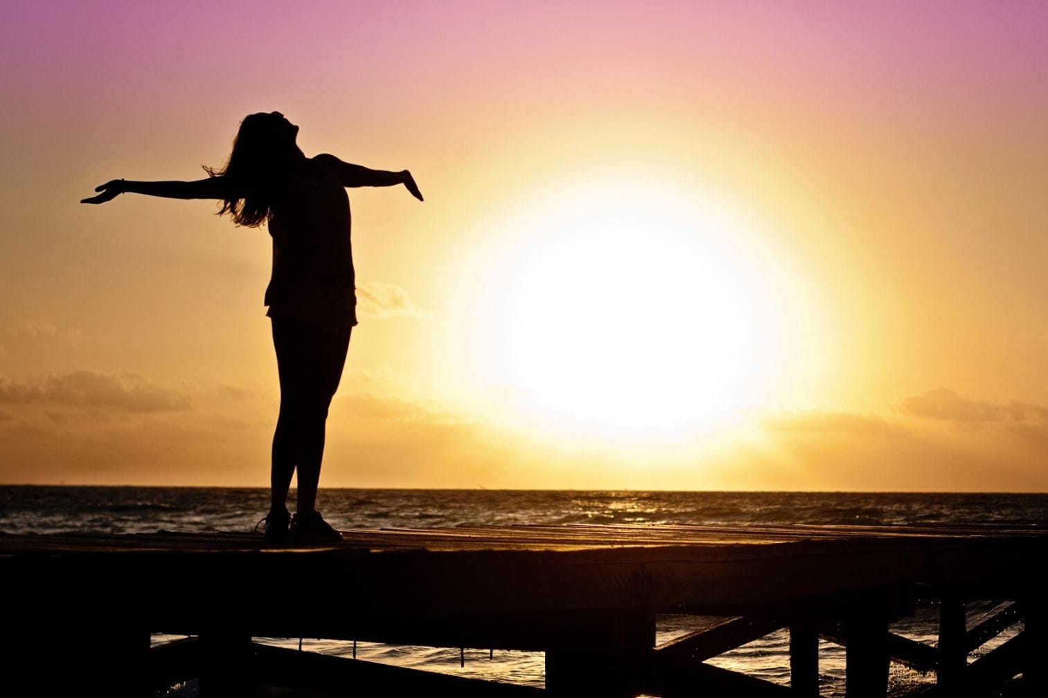 A girl enjoying a sunset moment