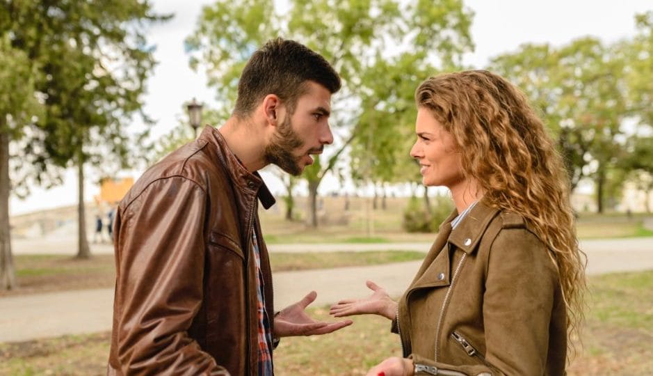 A man and a woman talking and arguing with earch other