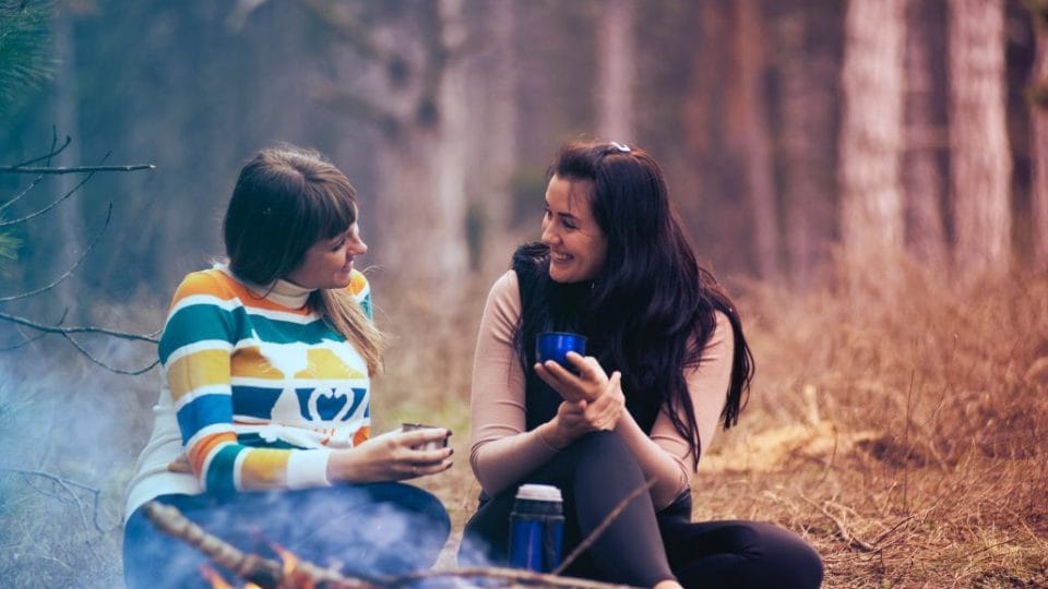 Two Girls Smiling At Each Other Understand What Others Feel