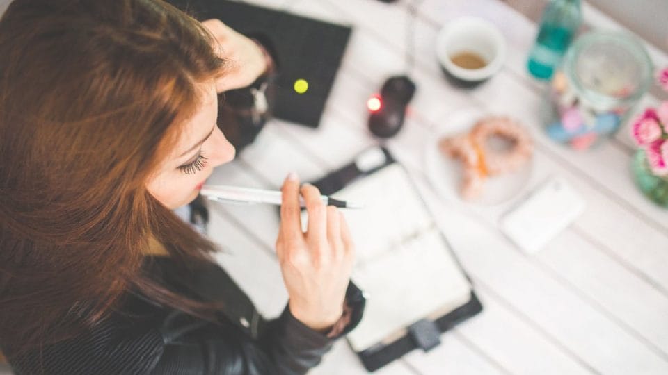 Young Woman Thinking While Working