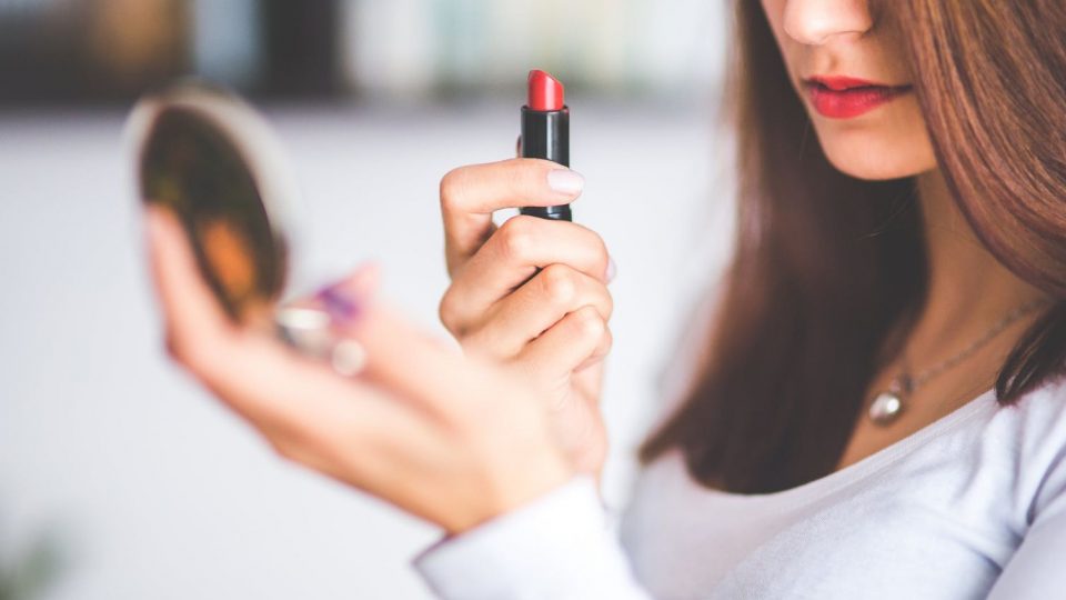 Girl Doing A Makeup Lipstick