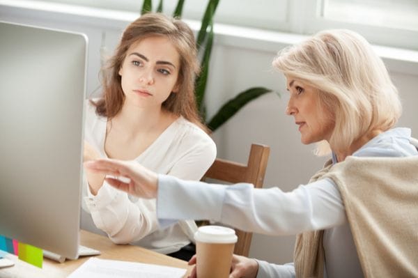 A Woman Helping Her Colleague In Office - Be More Confident