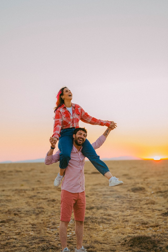 Funny couple posing and making selfie photo on white background Stock Photo  - Alamy