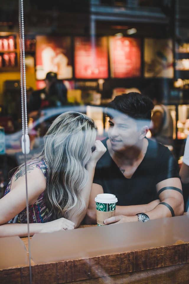 Talking To Her Or Whispering In His Ear