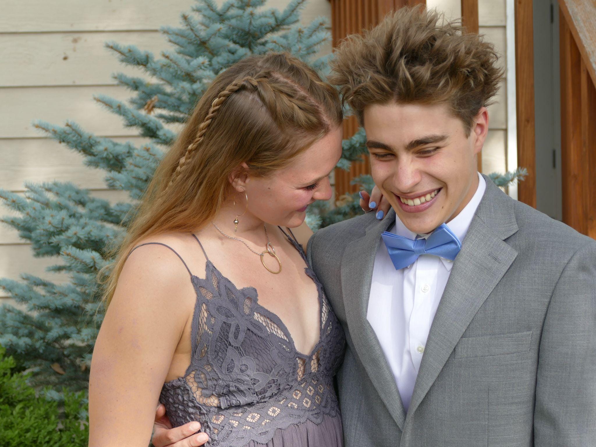 Happy couple dressed for homecoming